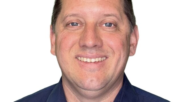Michael Smiling blue polo shirt